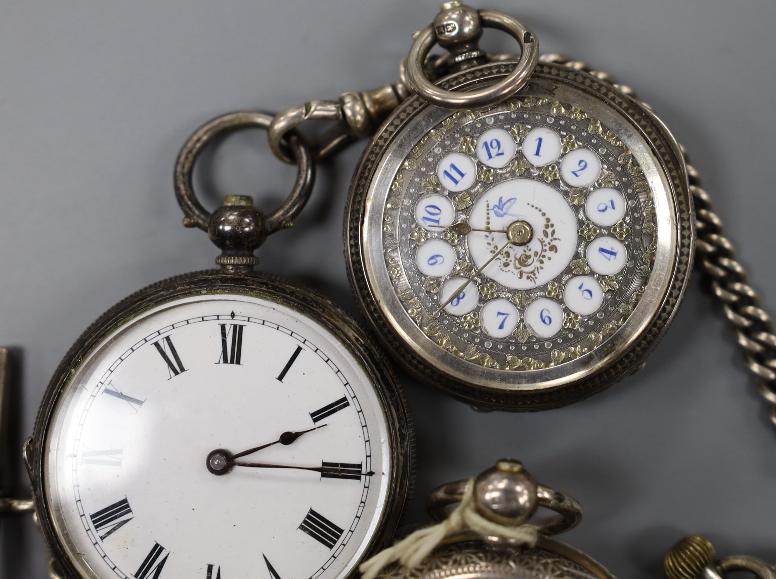 Four assorted late 19th century silver or white metal fob watches including two with case.